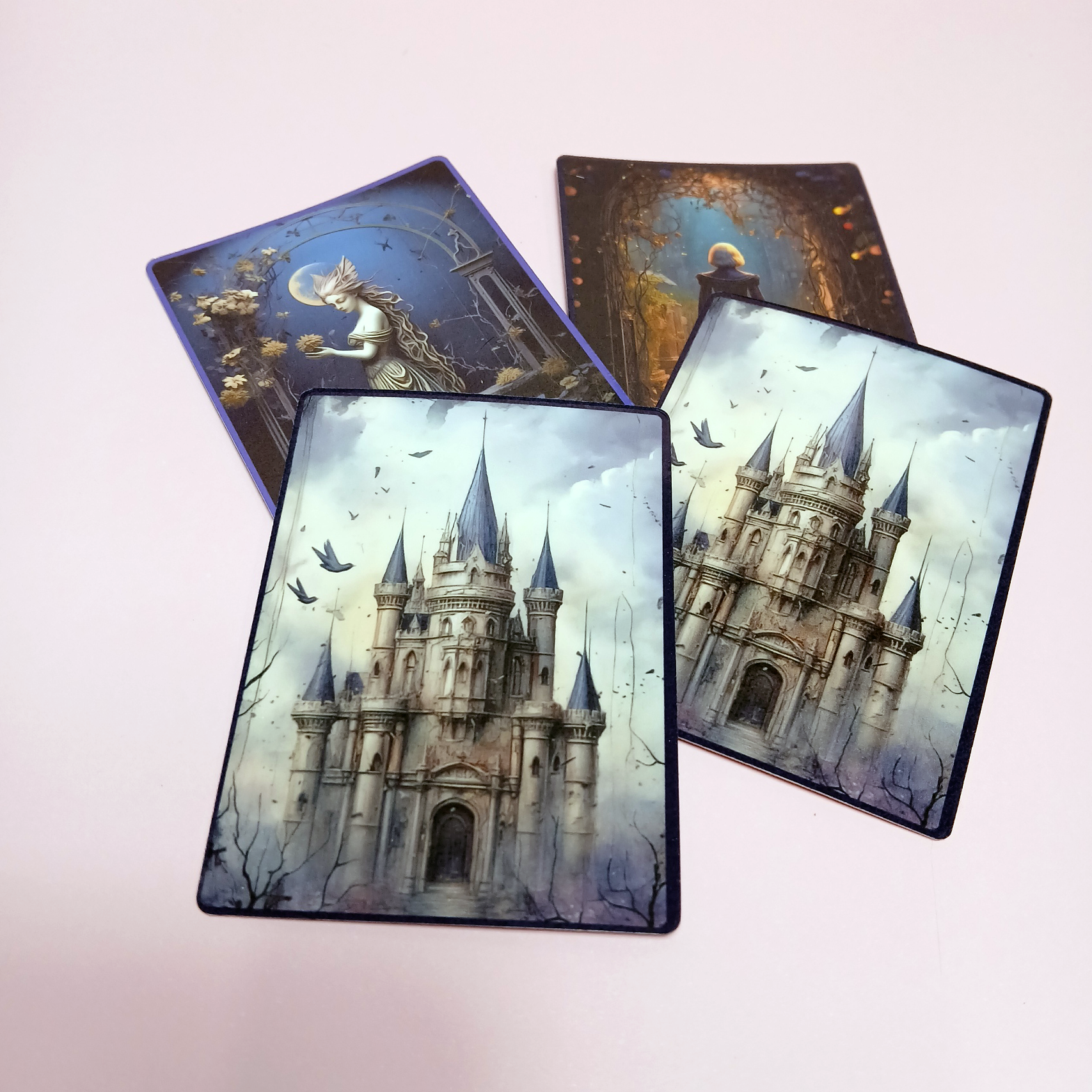 Four cards with castle designs on a light pink background. Dreamy fantasy worlds.